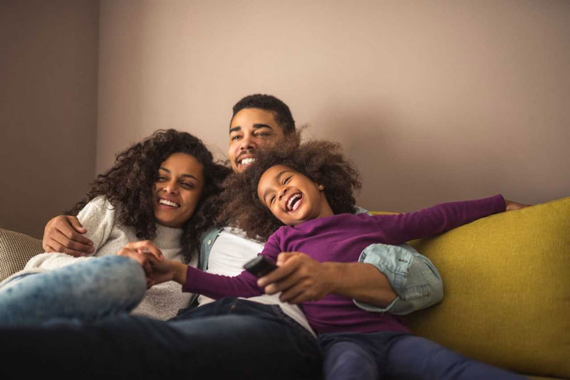 Homelife image of family on a sofa